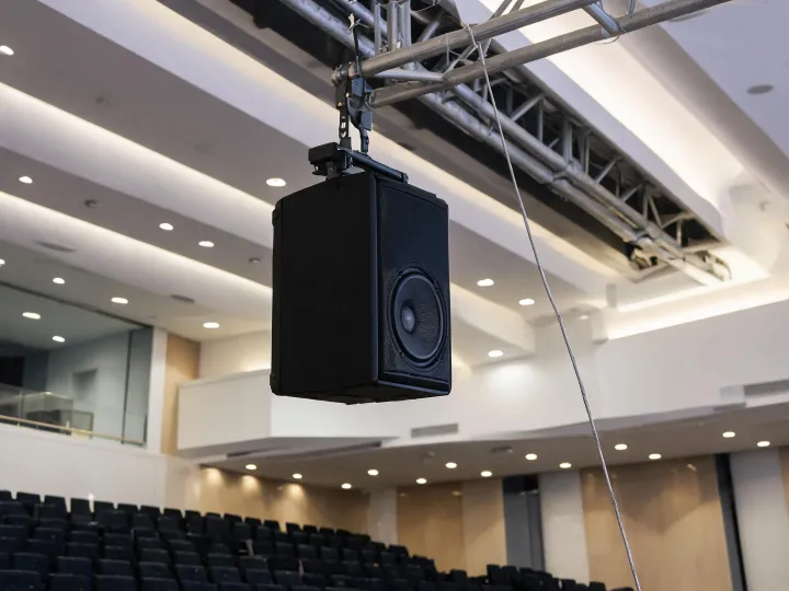Installed point-source loudspeaker in an auditorium